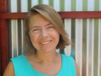 Tena Overacker smiling, wearing a teal top